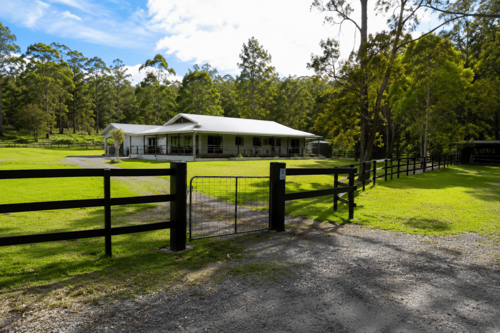 building and pest inspection gympie rural house with timber fence entrance