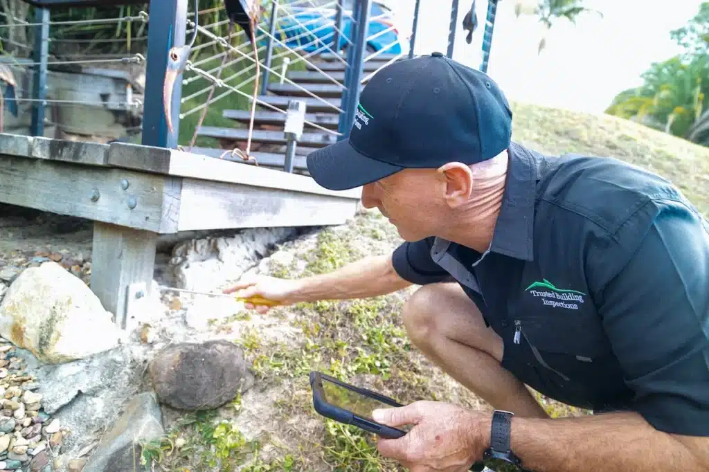 building and pest inspection buderim, inspecting a timber deck on a sloping block
